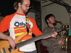 Shane Reichart on bass guitar and Eric Bright on saxophone